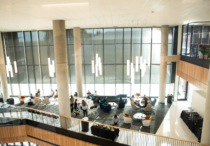 Aerial overlook of students in Rowling Hall sitting area