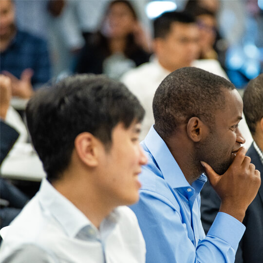Students listen attentively at an MBA career panel