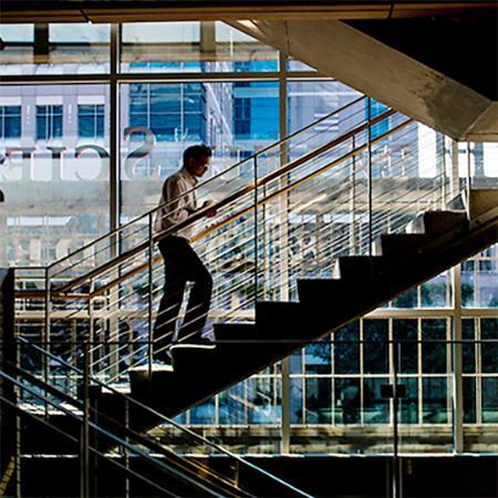 MBA student ascends stairs in Houston