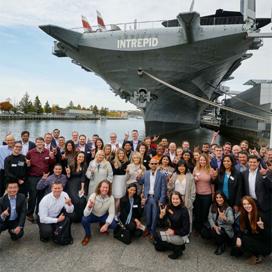 executive mba students by the intrepid ship in New York City