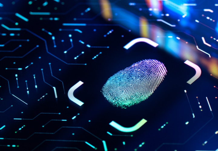 Glowing biometric fingerprint on a black screen.
