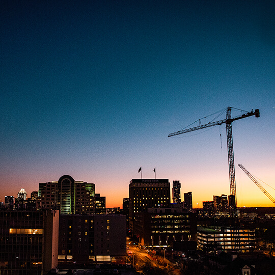Austin skyline and crane at sunset