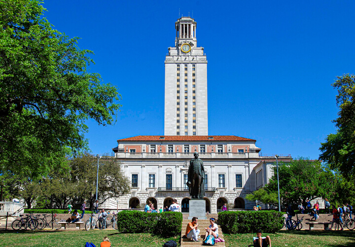 University of Texas tower in front of a blue sky