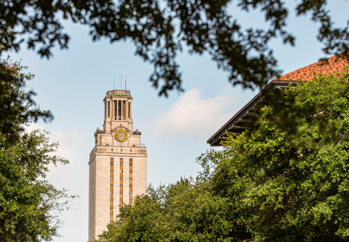 University of Texas tower with trees in the foreground