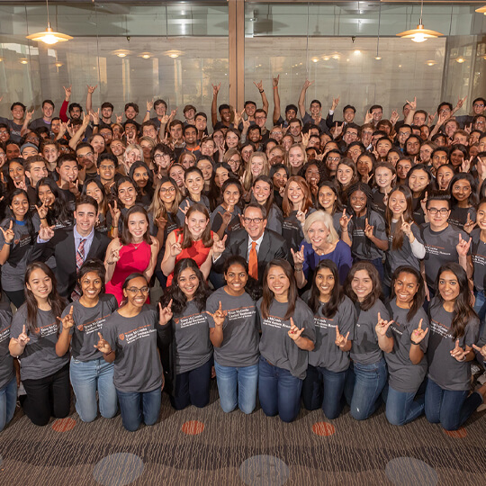 Canfield Business Honors students giving hook em horns