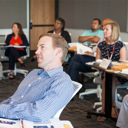 Texas Executive Education students listen in class