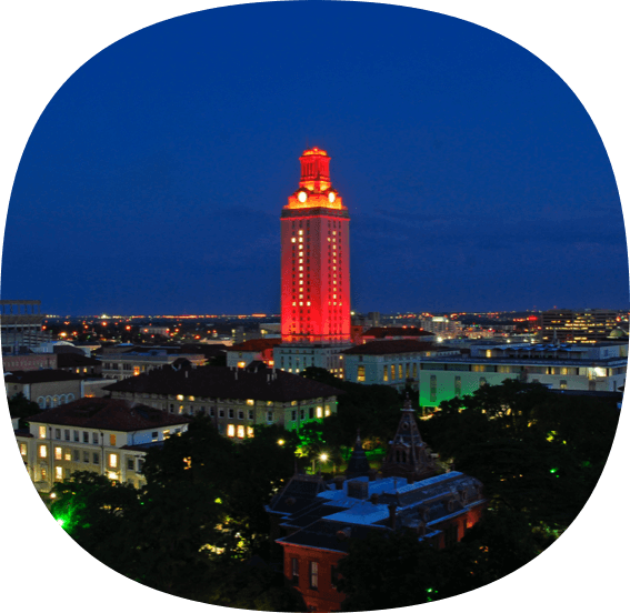 Tower at the Univeristy of Texas illuminated orange at night.