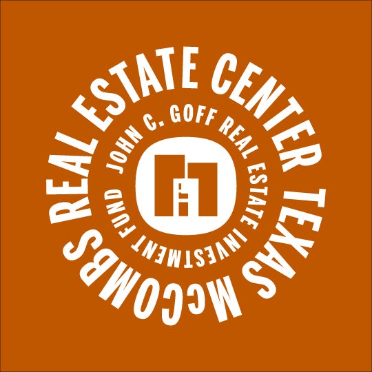 Texas McCombs MBA students taking notes and listening to a lecture in class