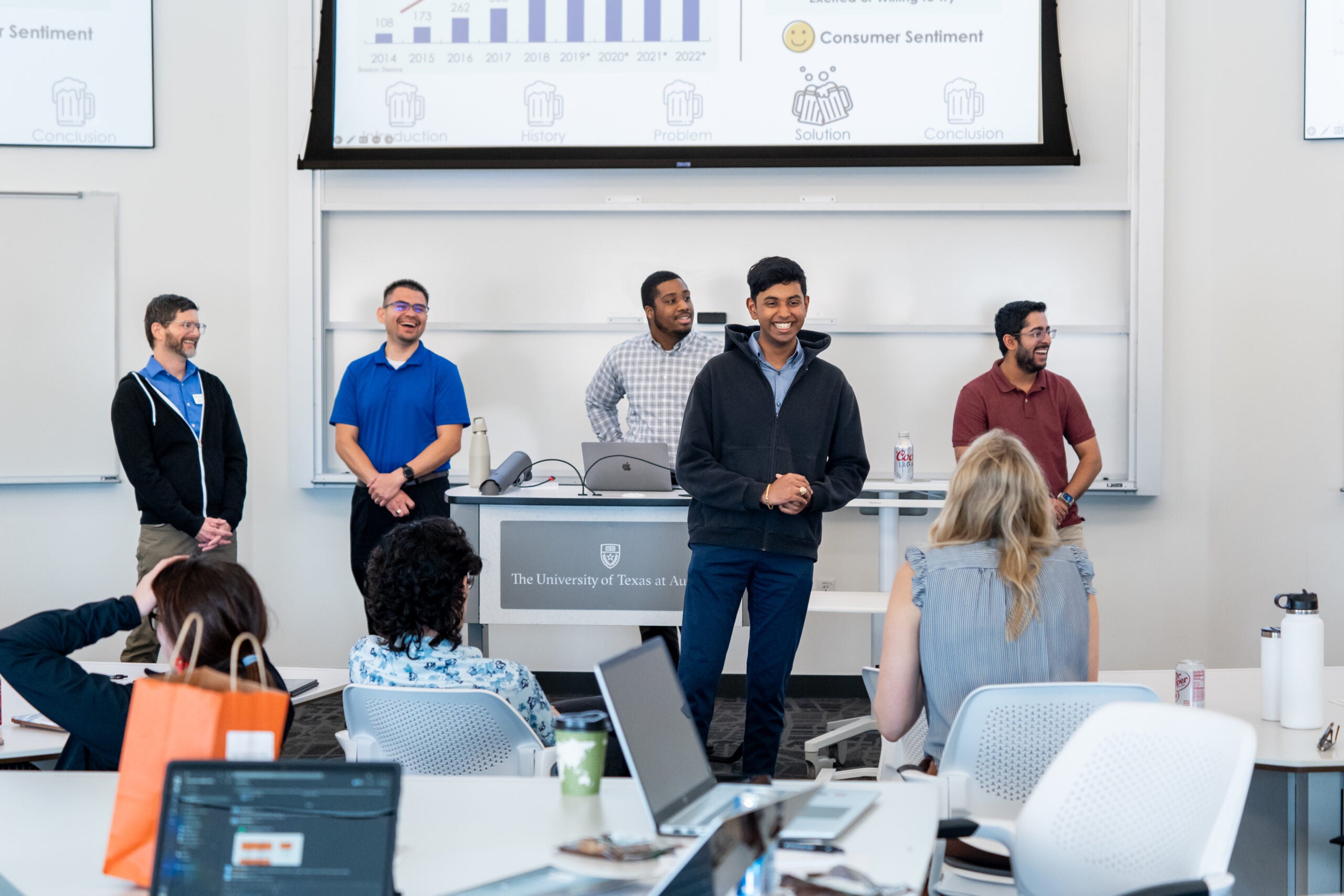 Photo of MSBA students presenting data at the front of a classroom.