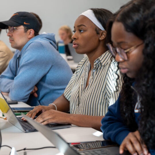 Students in class focusing on a lecture