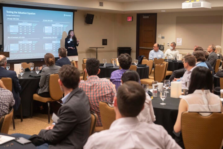 Group of conference attendees listening to a presentation