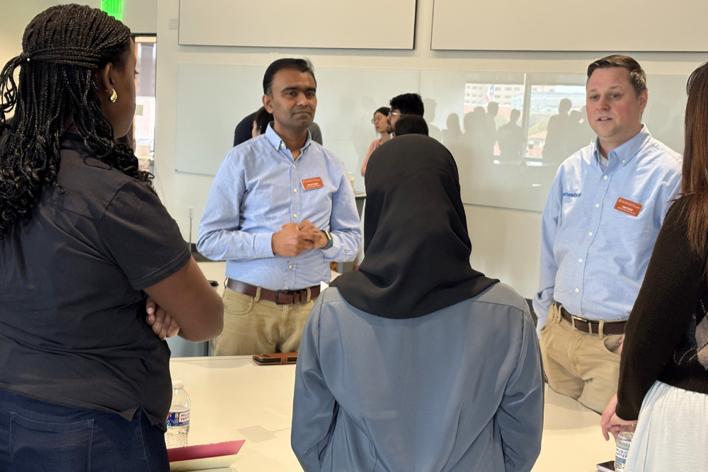 MSITM Advisory Council members speak with a group of students