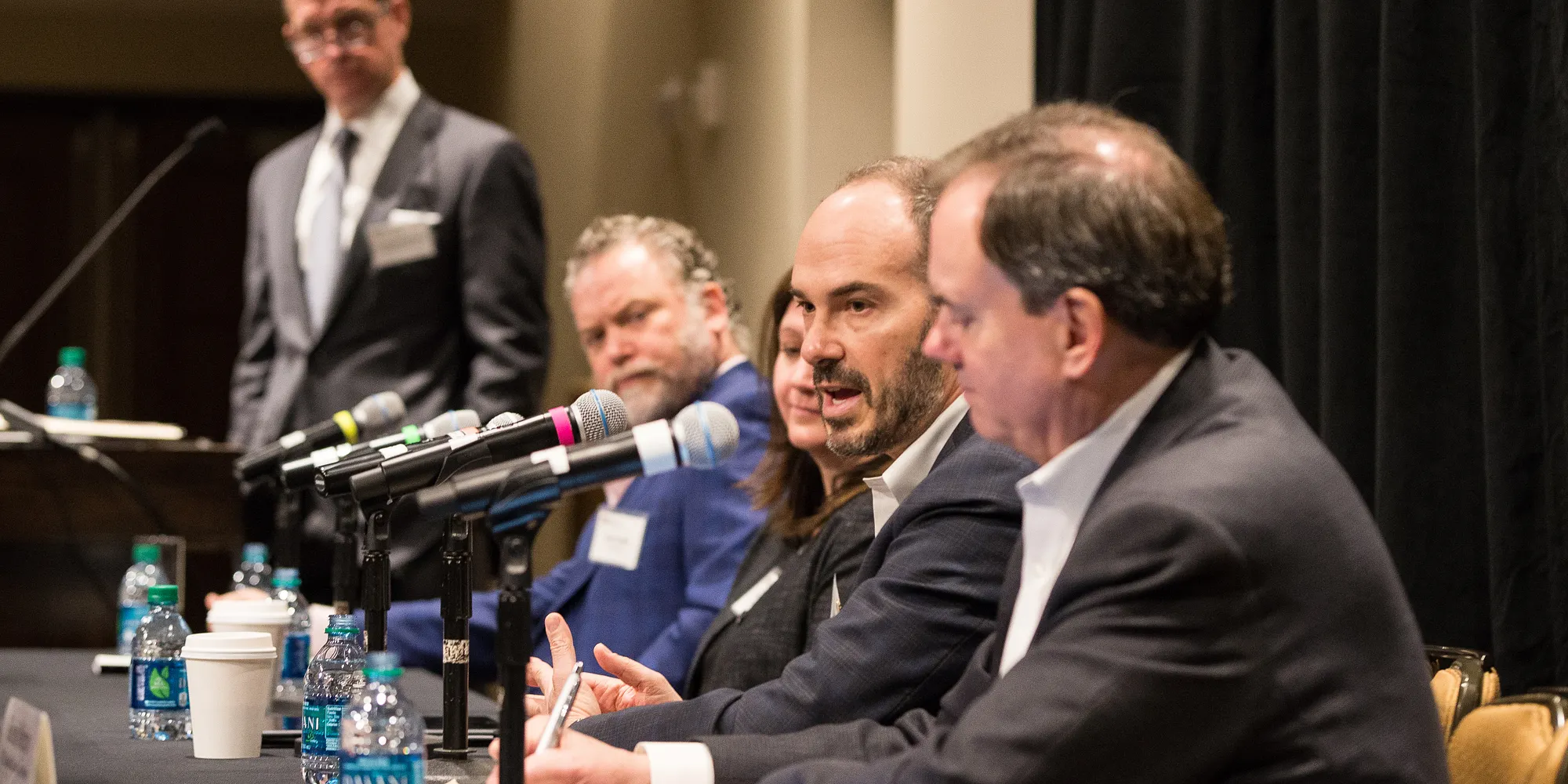Speaker addressing audience at a conference
