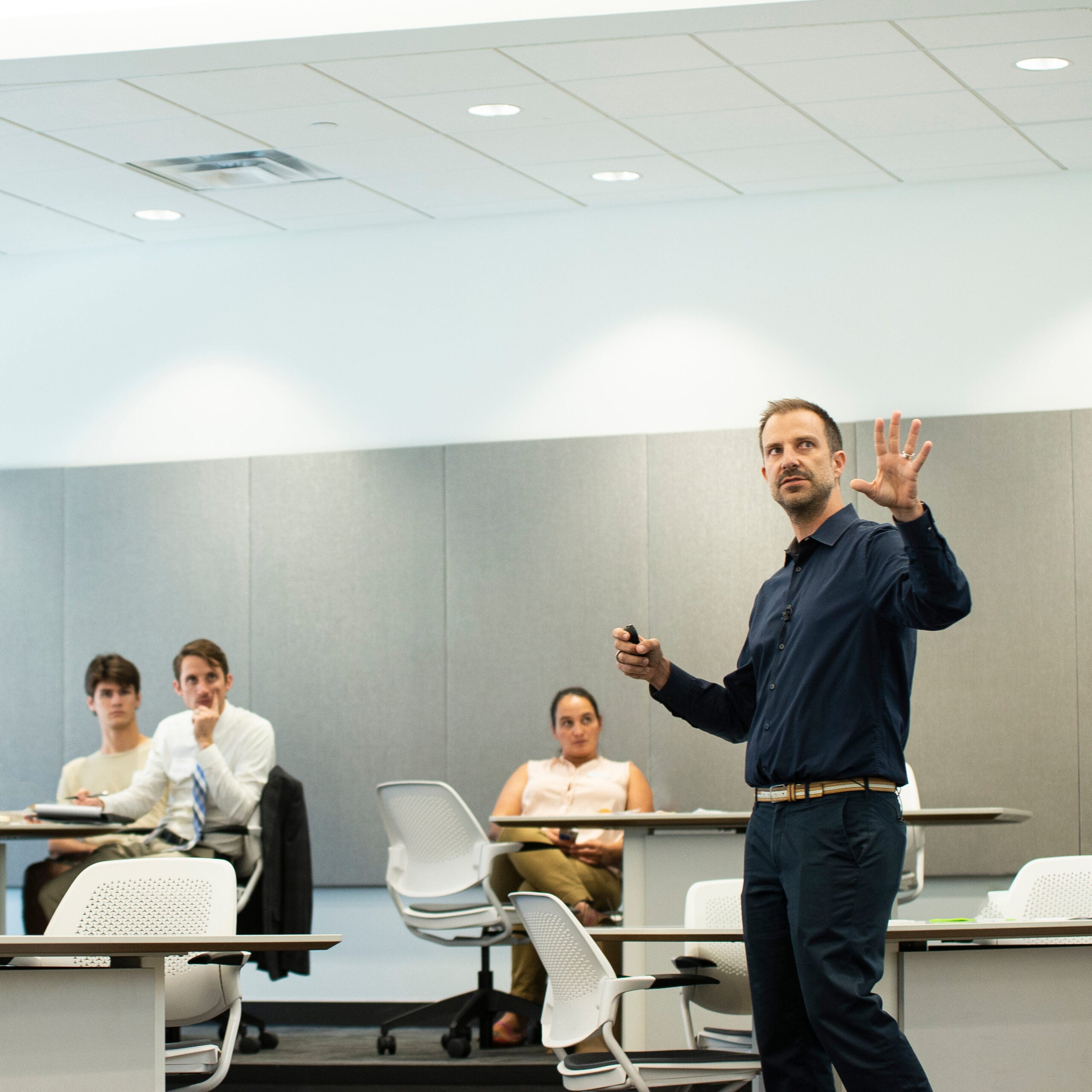 Man speaking to class.