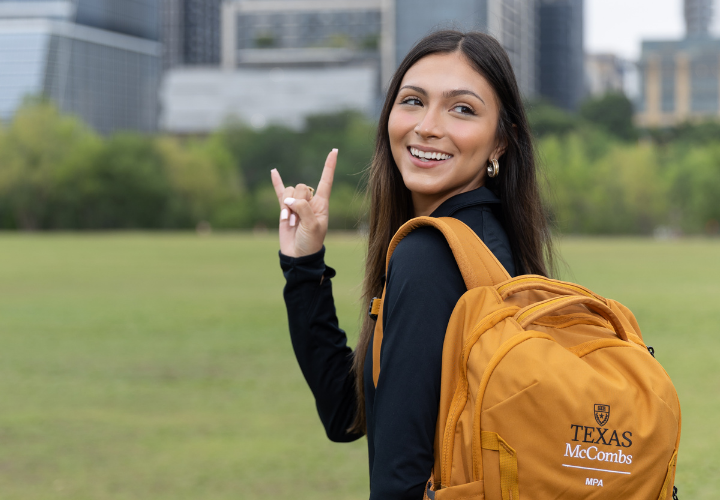 MPA student Celia Simpson walking with backpack