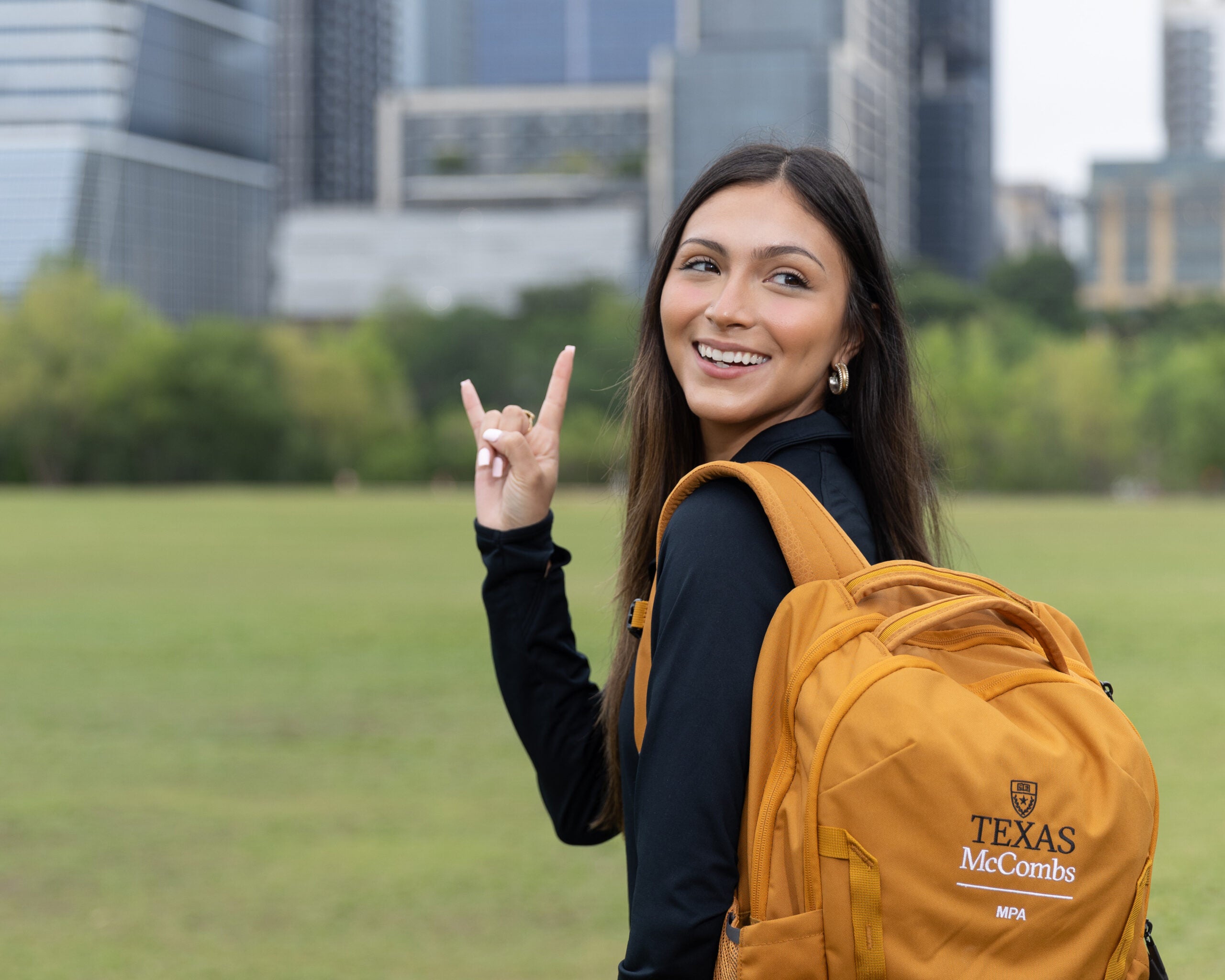 MPA student Celia Simpson walking with backpack
